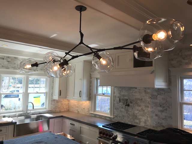 Custom island chandelier installation